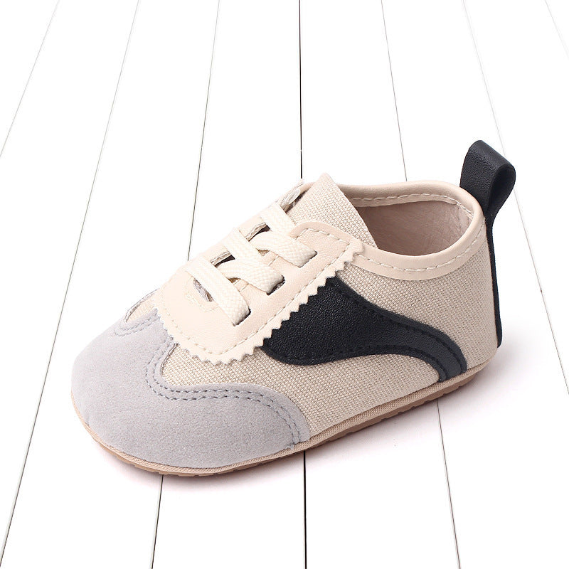 Soft Sole Sneakers in beige and black, featuring a lightweight design and cushioned support for comfort.