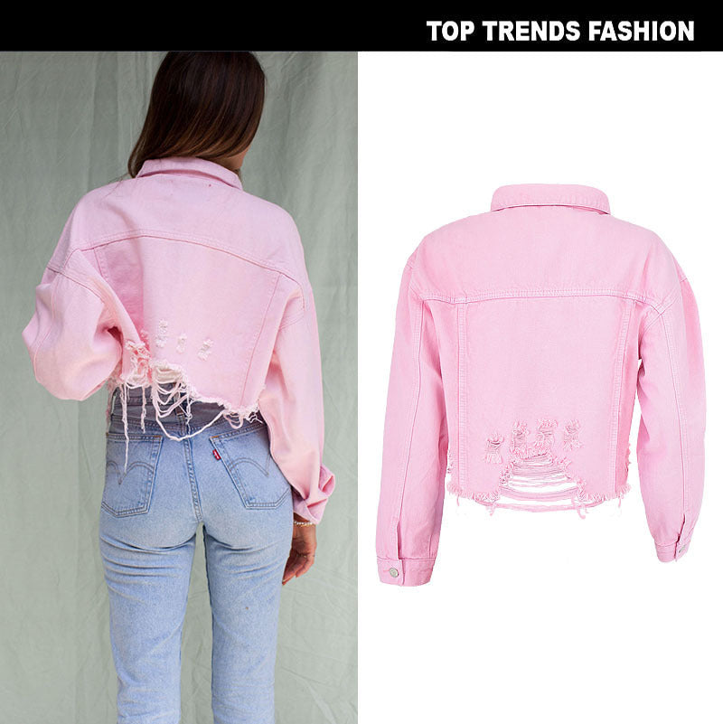 Back view of a stylish short denim jacket in pink with distressed detailing.