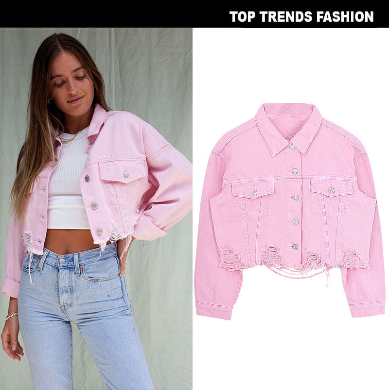 Short denim jacket worn by a model with light jeans, showcasing a stylish cropped design in pink.