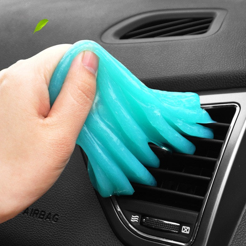 Soft Gel Car Air Vent Cleaner removing dust from car vents